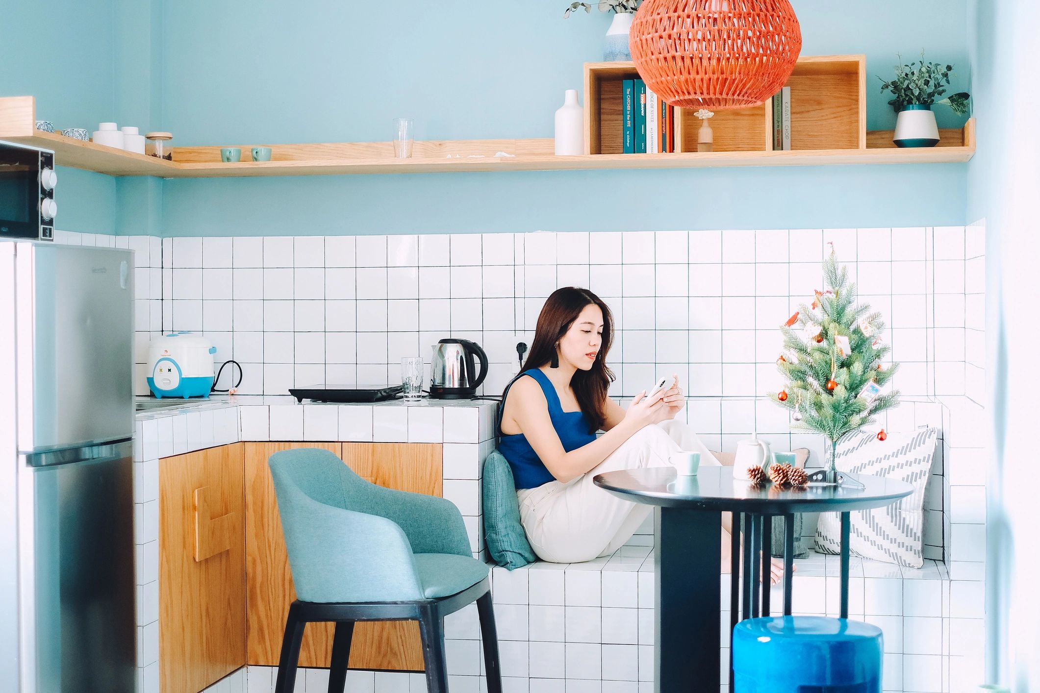 Young woman relaxing at home in bright sunlight