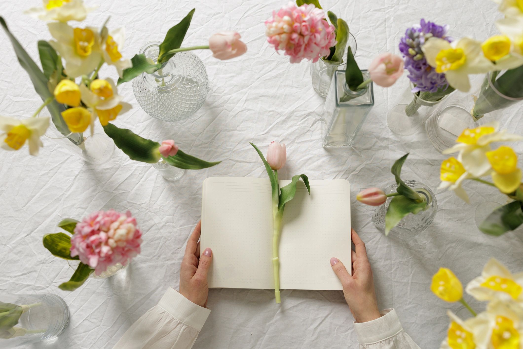 Open notebook with flowers for editorial inspiration