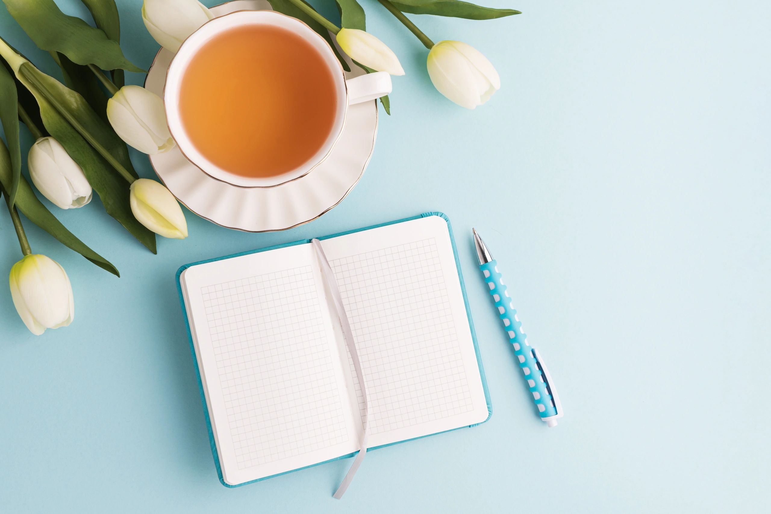 Lifestyle flat lay with tea and flowers